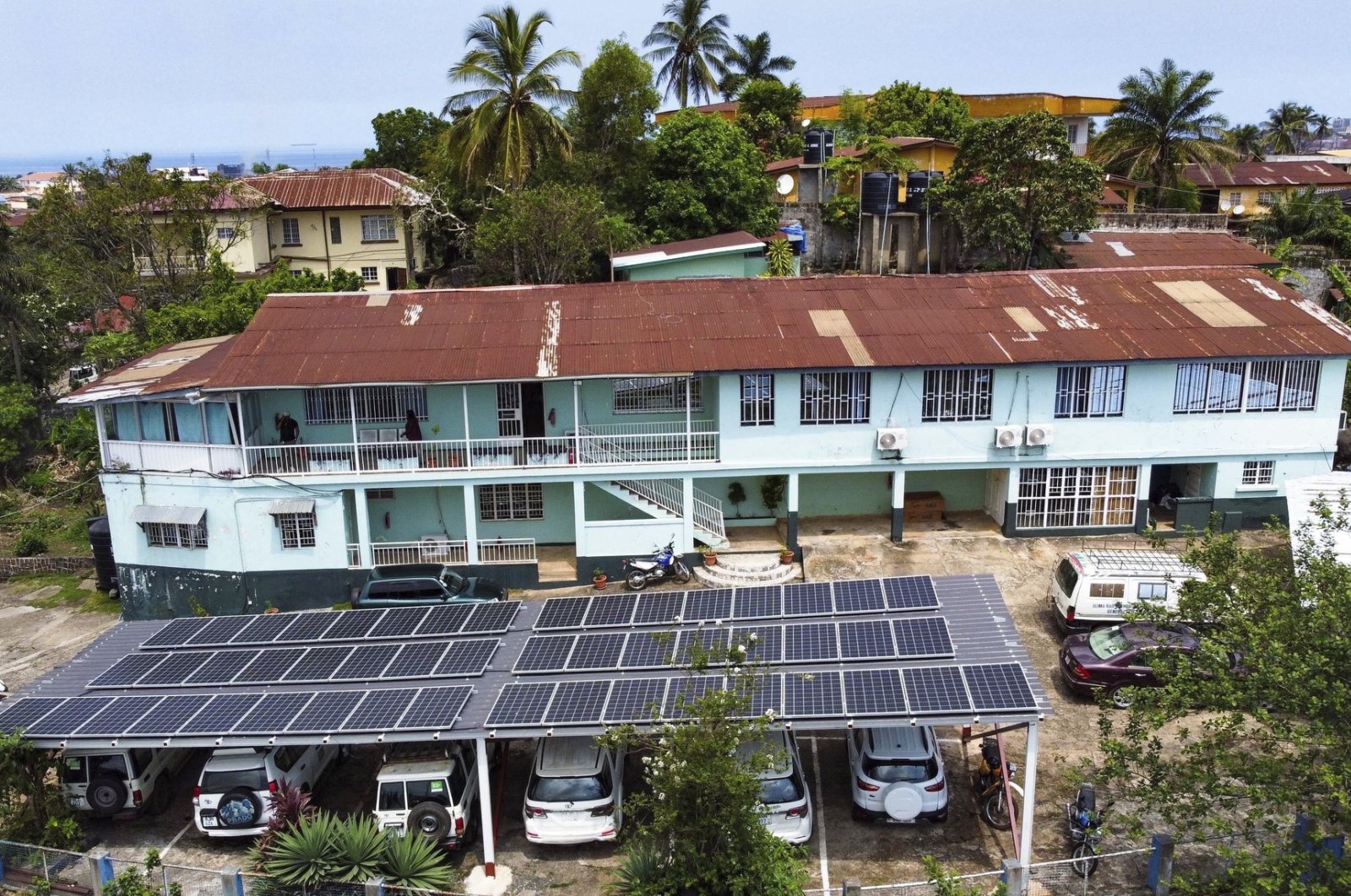 This photo released by Easy Solar shows a large solar panels installation on a rooftop of an office building in Freetown, Sierra Leone, Aug. 13, 2024. (AP Photo)