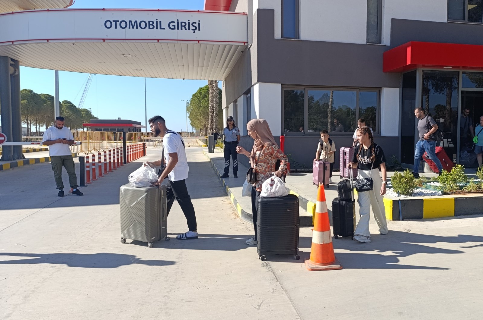 People leave the port after disembarking the vessel that arrived from Lebanon, in Silifke, Mersin, southern Türkiye, Oct. 6, 2024. (İHA Photo)