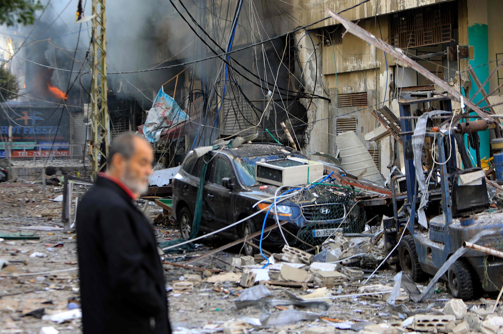 A man stands in the midst of the devastation in the aftermath of an Israeli strike in the southern suburbs of Beirut, Lebanon, Oct. 6, 2024. (AFP Photo) 