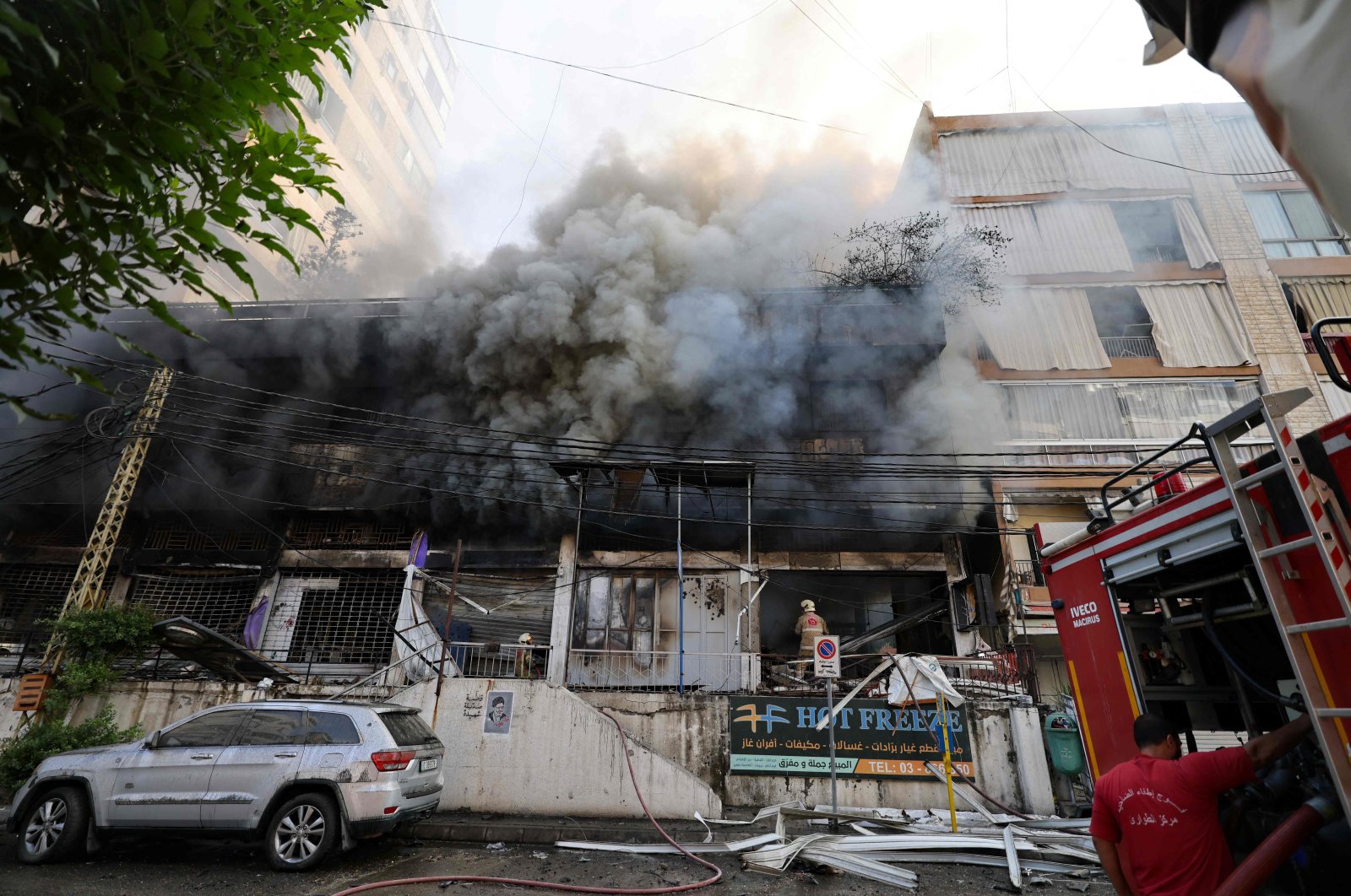 First responders fight the blaze inside a building set on fire by an Israeli strike that targeted Beirut’s southern suburbs, Lebanon, Oct. 6, 2024. (AFP Photo)