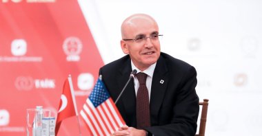 Treasury and Finance Minister Mehmet Şimşek attends a meeting during a visit to New York, U.S., Sept. 26, 2024. (AA Photo)