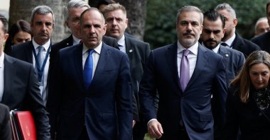 Foreign Minister Hakan Fidan (R) and Greek Foreign Minister Giorgos Gerapetritis walk outside of the Presidential Palace in Athens, Greece, Dec. 7, 2023. (Reuters Photo)