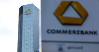 A logo of the bank is seen next to the headquarters of Commerzbank one day ahead of the bank&#039;s rejoinment to Germany&#039;s share price index DAX in Frankfurt, Germany, Feb. 26, 2023. (Reuters Photo)