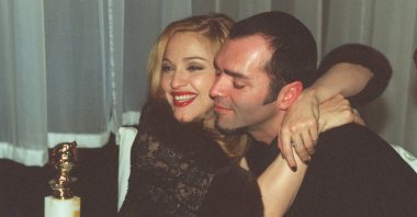 Madonna celebrates with her brother Christopher Ciccone after winning the Golden Globe for Best Actress in Motion Picture Musical or Comedy, at the Disney party following the awards ceremony, Los Angeles, California, U.S., Jan. 19, 1997. (Getty Images)