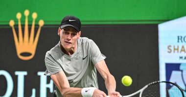 Italy's Jannik Sinner hits a return to Argentina's Tomas Martin Etcheverry during their men's singles match at the Shanghai Masters, Shanghai, China, Oct. 6, 2024. (AFP Photo)