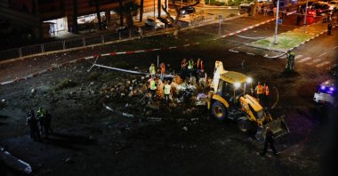 Israeli rescuers inspect the site where a projectile fell, amid cross-border hostilities with Hezbollah, in Haifa, northern Israel, Oct. 7, 2024. (Reuters Photo)