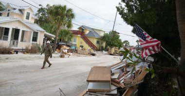 A member of the Florida Army National Guard during debris removal in the Pass-A-Grille section of St. Petersburg ahead of Hurricane Milton&amp;#039;s expected landfall in the middle of this week, Oct. 7, 2024. (AFP Photo)