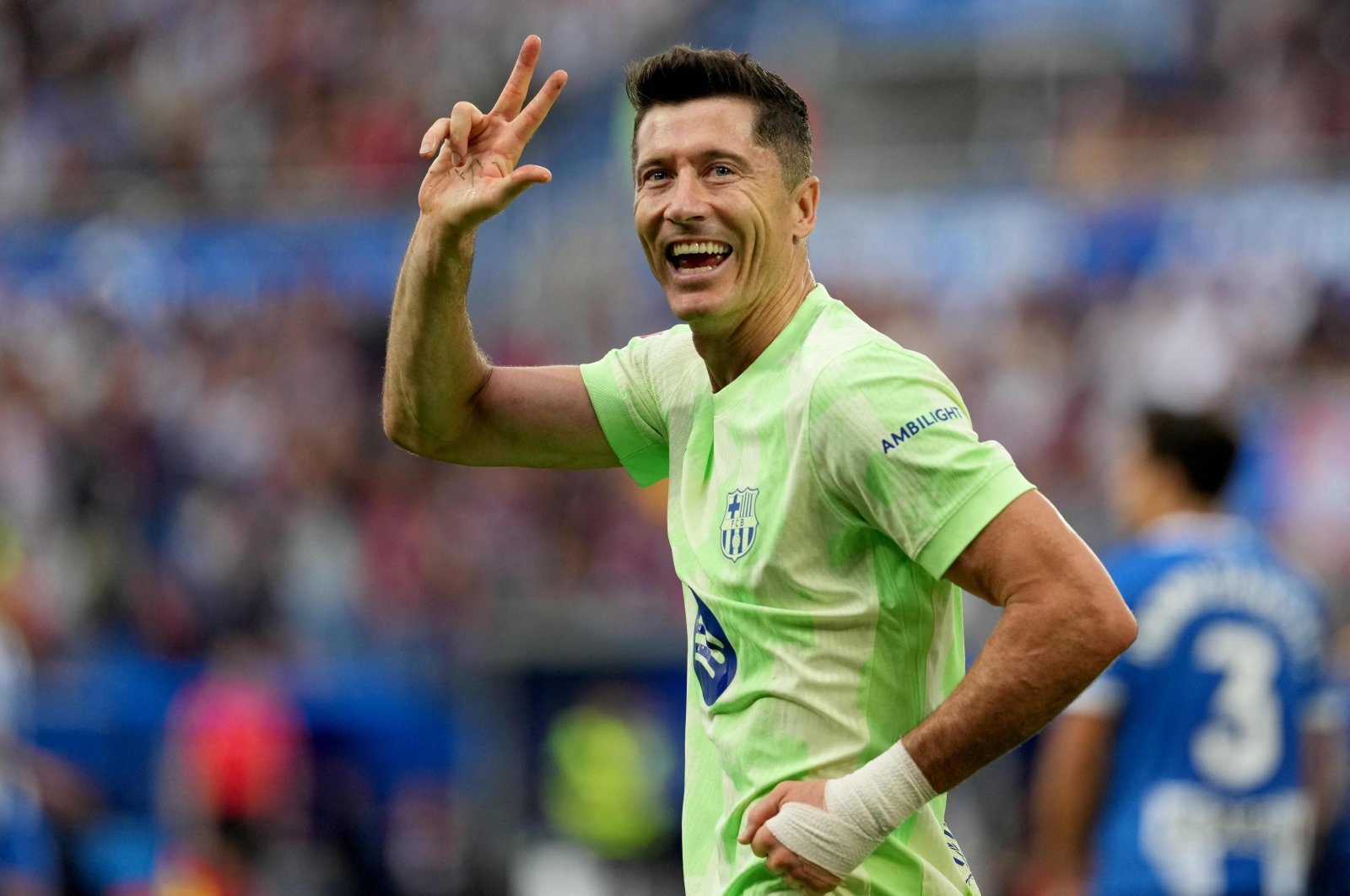 Barcelona&#039;s Robert Lewandowski celebrates after scoring a hat trick during the Spanish league football match between Deportivo Alaves and FC Barcelona at the Mendizorroza stadium, Vitoria, Spain, Oct. 6, 2024. (AFP Photo)