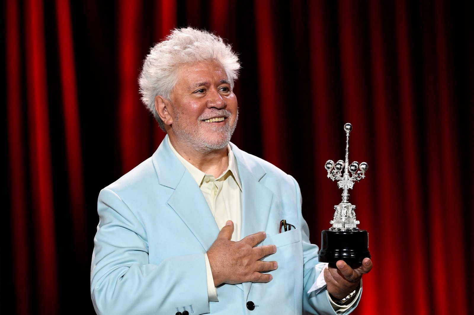 Spanish director Pedro Almodovar gestures after receiving the Donostia Lifetime Achievement Award in recognition of his career, during the 72nd San Sebastian International Film Festival, the Basque city of San Sebastian, Spain, Sept. 26, 2024. (AFP Photo)