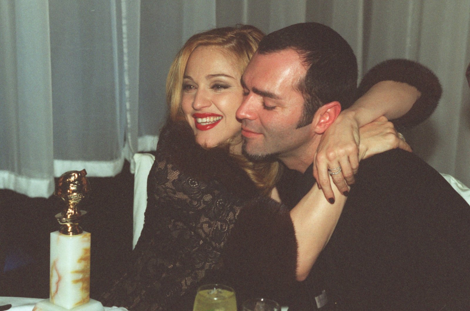 Madonna celebrates with her brother Christopher Ciccone after winning the Golden Globe for Best Actress in Motion Picture Musical or Comedy, at the Disney party following the awards ceremony, Los Angeles, California, U.S., Jan. 19, 1997. (Getty Images)