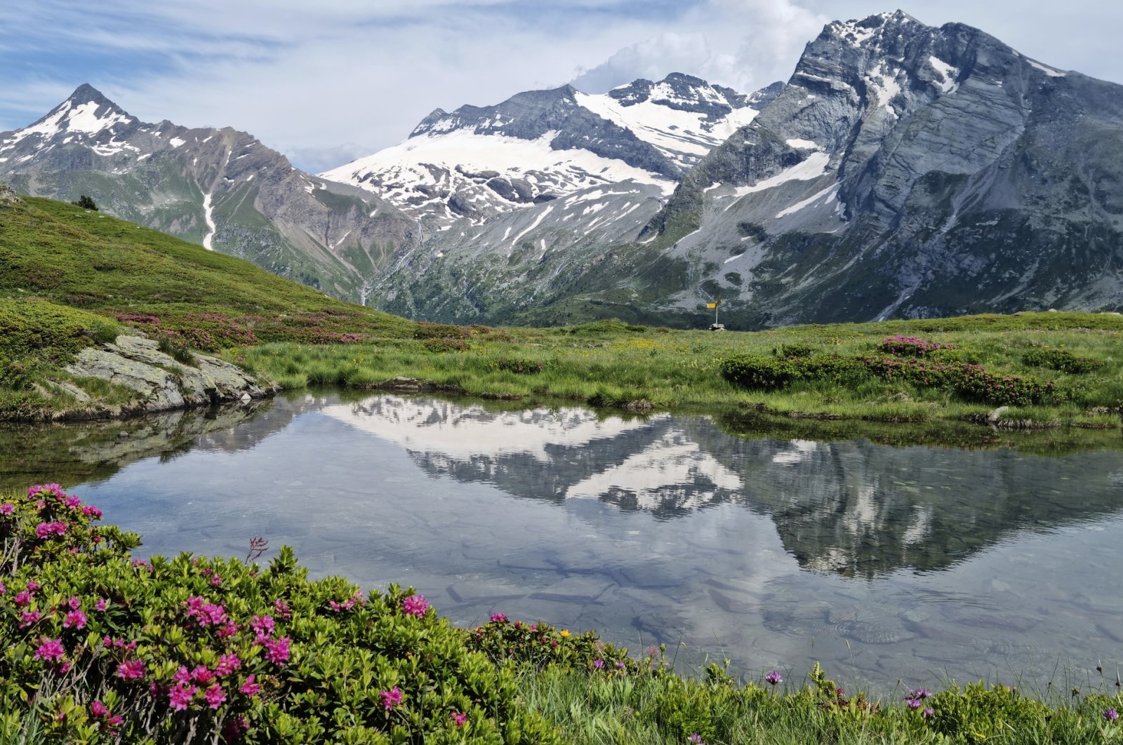 Alpine Pond on Mt. Tochuhorn at Simplon Pass, nestled between the Lepontine and Pennine Alps, marks the international border between Switzerland and Italy, July 19, 2024. (Getty Images)