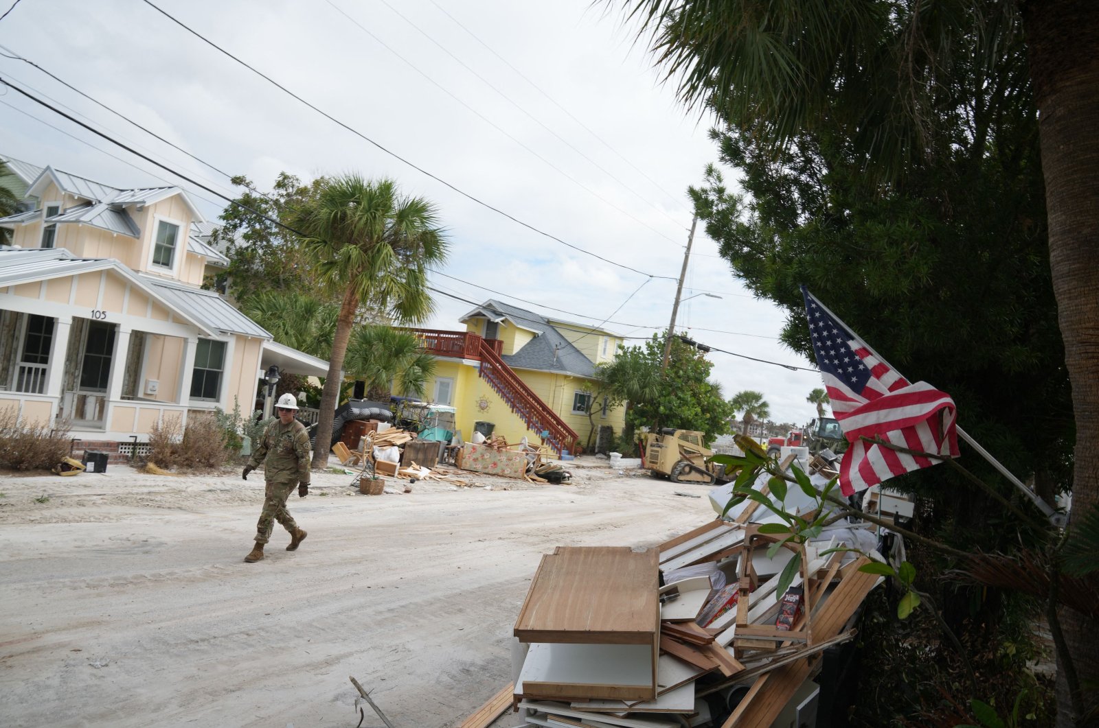 A member of the Florida Army National Guard during debris removal in the Pass-A-Grille section of St. Petersburg ahead of Hurricane Milton&amp;#039;s expected landfall in the middle of this week, Oct. 7, 2024. (AFP Photo)