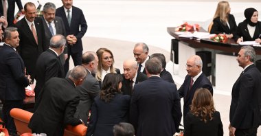 Devlet Bahçeli (C), chair of the Nationalist Movement Party (MHP), shakes hands with members of the Peoples’ Equality and Democracy Party (DEM Party) and the Republican People's Party (CHP) at the opening of the 28th term legal year of Parliament, Ankara, Türkiye, Oct. 1, 2024. (AA Photo)