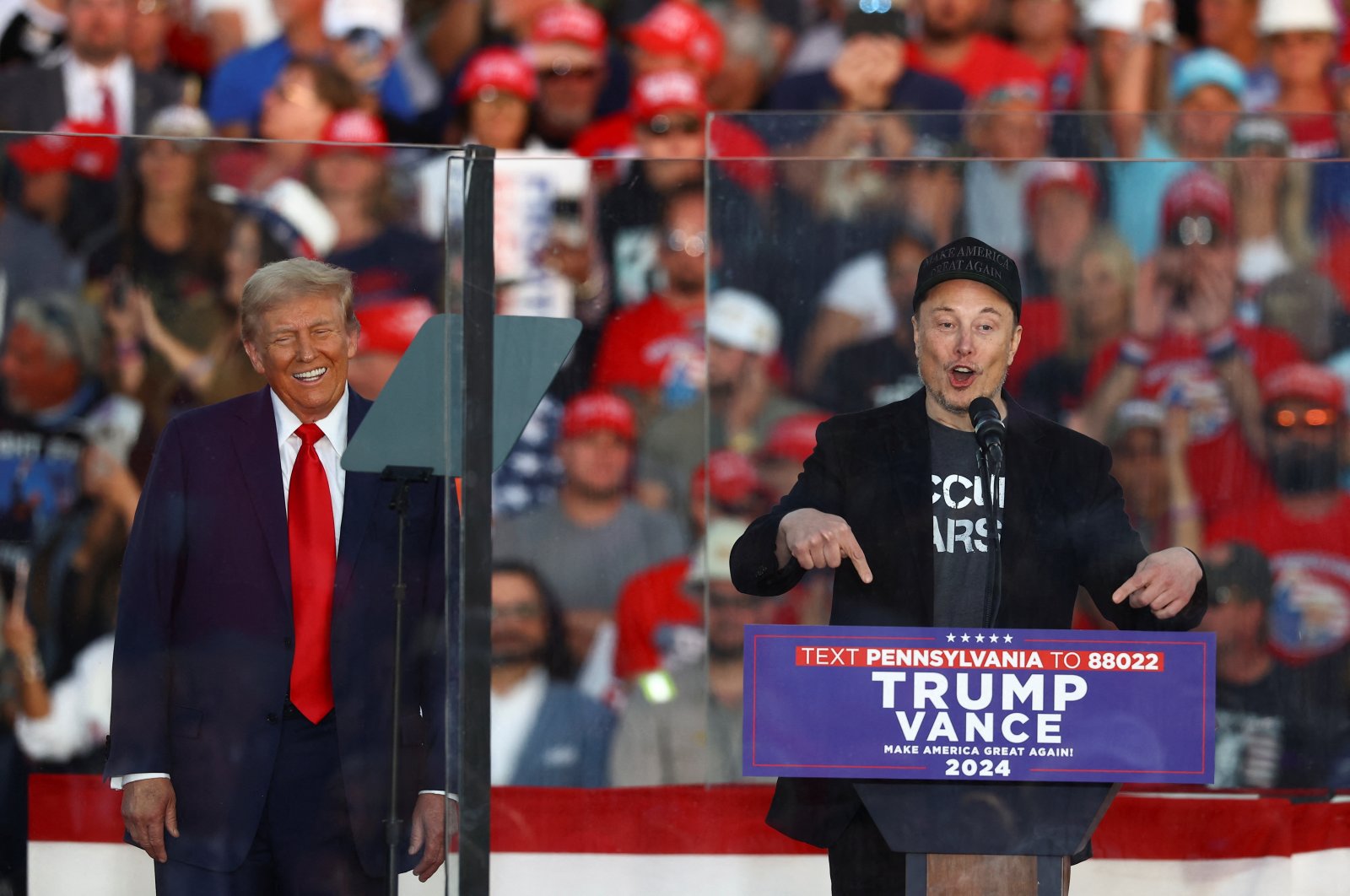 Tesla CEO and X owner Elon Musk speaks as Republican presidential nominee and former U.S. president Donald Trump reacts during a rally, in Butler, Pennsylvania, U.S., Oct. 5, 2024. (Reuters Photo)