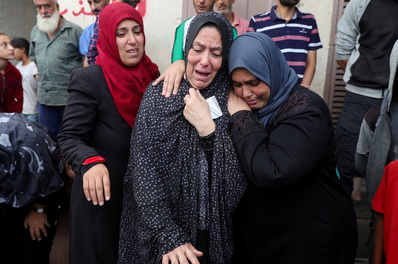 Mourners react next to the bodies of Palestinians killed in Israeli strikes amid the Israeli attacks, at Al-Aqsa Martyrs Hospital, Deir Al-Balah, Gaza Strip, Palestine, Oct. 8, 2024. (Reuters Photo)