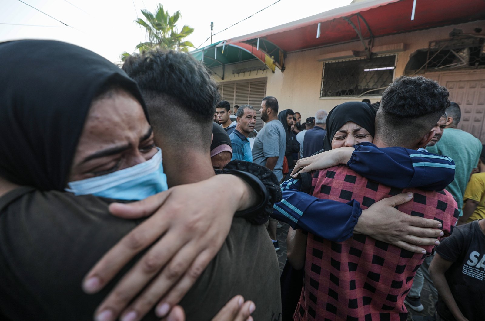 Relatives mourn during the funeral for Palestinians killed in an early morning Israeli airstrike on the Al Bureij refugee camp, Deir Al Balah town, central Gaza Strip, Oct. 8, 2024. (EPA Photo)