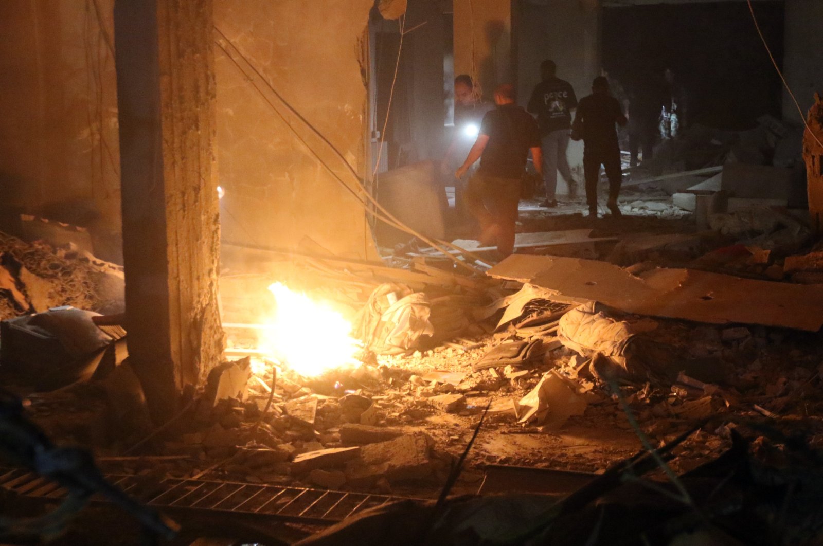 People inspect the site of a military strike in the al-Mazzeh neighborhood in Damascus, Syria, Oct. 2, 2024. (EPA File Photo)