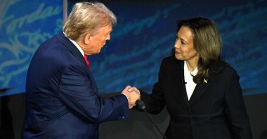 U.S. Vice President and Democratic presidential candidate Kamala Harris (R) shakes hands with former U.S. President and Republican presidential candidate Donald Trump during a presidential debate at the National Constitution Center in Philadelphia, Pennsylvania, Sept. 10, 2024. (AFP Photo)