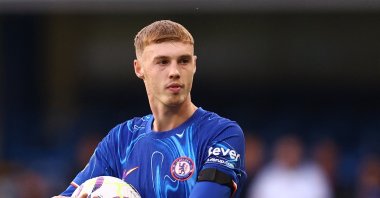 Chelsea's Cole Palmer celebrates with the match ball after scoring a hat trick during the Premier League match against Brighton & Hove Albion at the Stamford Bridge, London, U.K., Sept. 28, 2024. (Reuters Photo) 