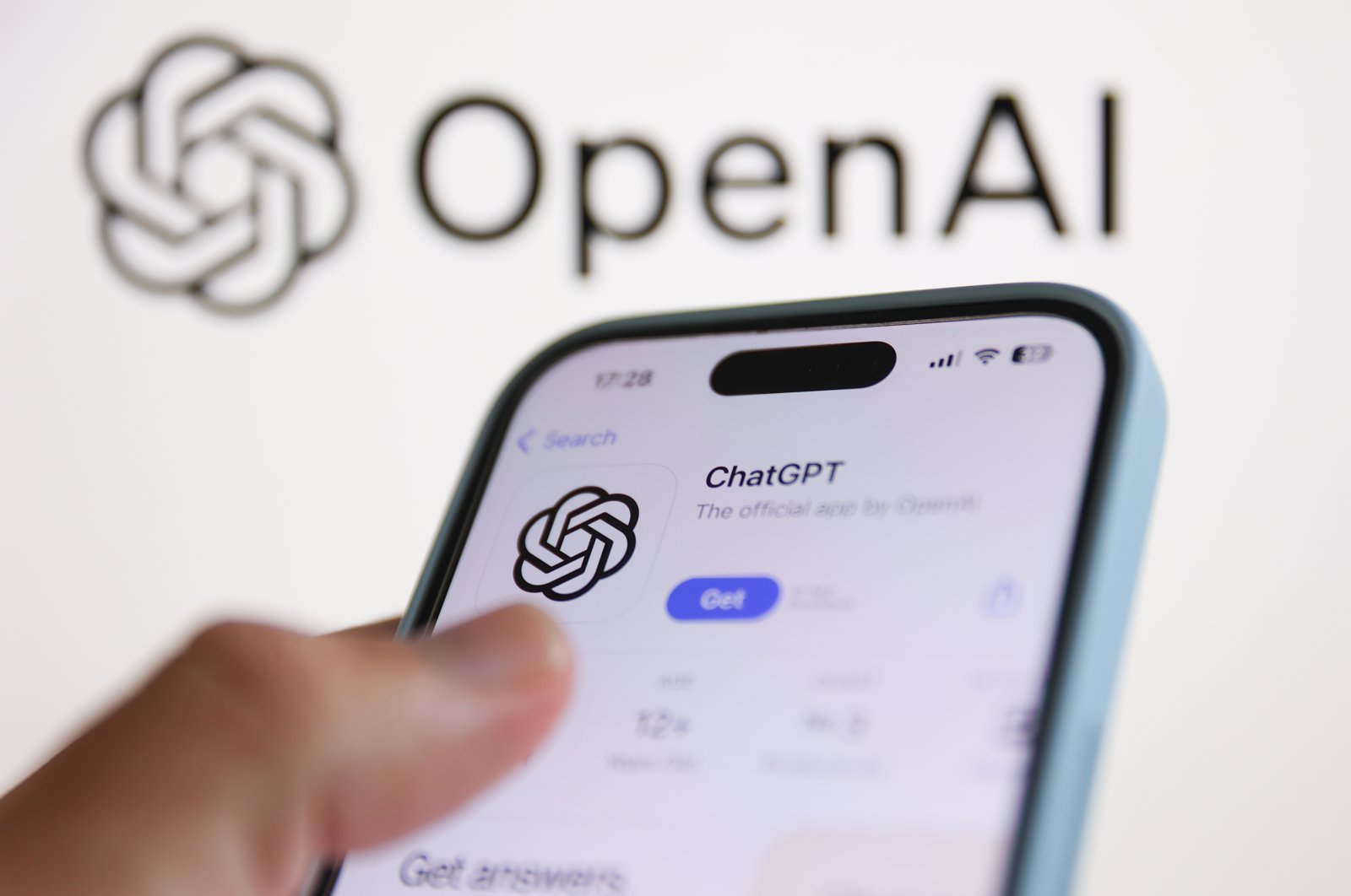 The OpenAI logo is displayed on a laptop screen along with the ChatGPT icon on AppStore displayed on a phone screen as seen in this illustration photo taken in Poland, Aug. 8, 2024. (Reuters Photo)