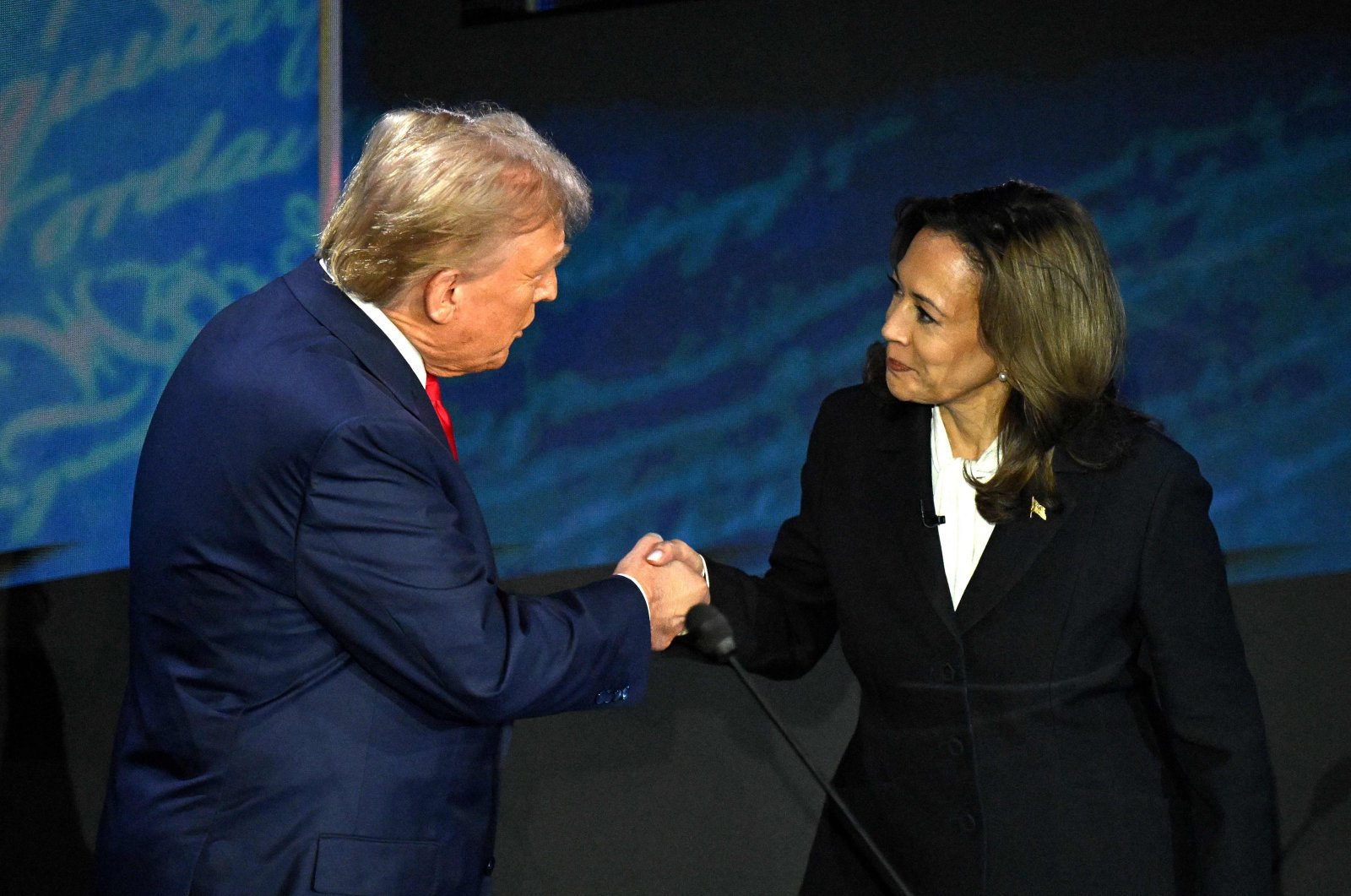 U.S. Vice President and Democratic presidential candidate Kamala Harris (R) shakes hands with former U.S. President and Republican presidential candidate Donald Trump during a presidential debate at the National Constitution Center in Philadelphia, Pennsylvania, Sept. 10, 2024. (AFP Photo)