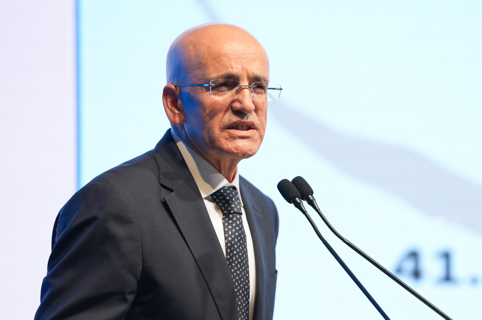 Treasury and Finance Minister Mehmet Şimşek delivers a speech at an event, Istanbul, Türkiye, Oct. 3, 2024. (AA Photo)