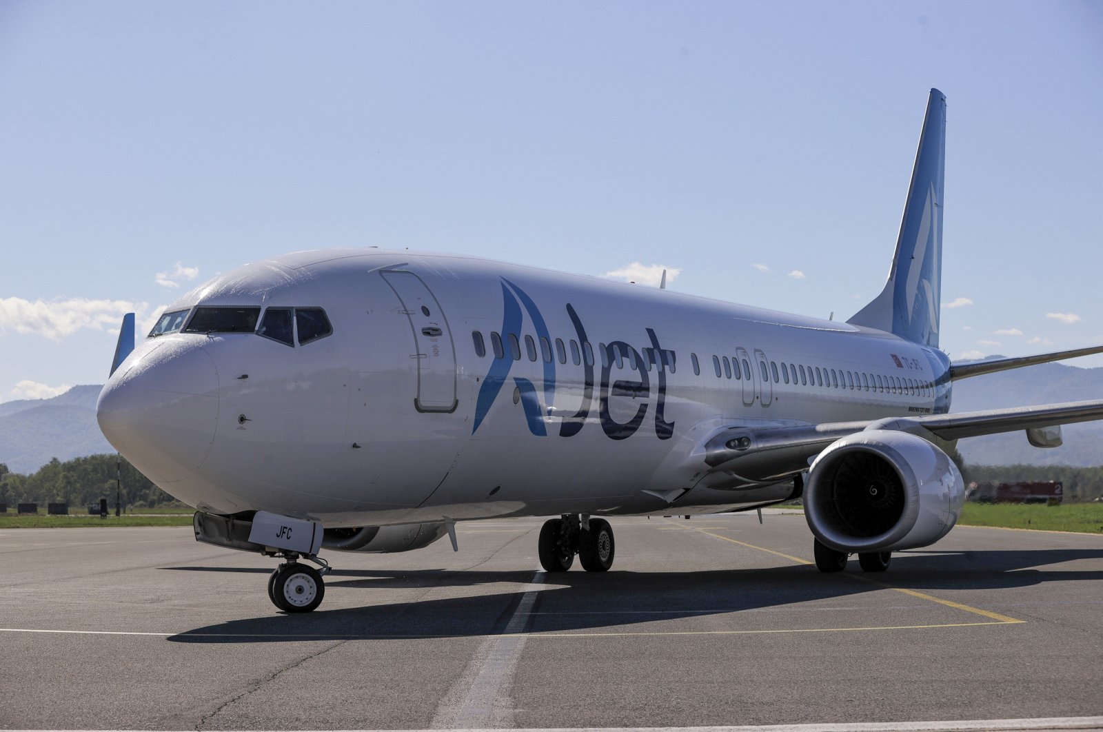 An AJet aircraft is seen landing at Tuzla International Airport, Tuzla, Bosnia-Herzegovina, Oct. 7, 2024. (AA Photo)