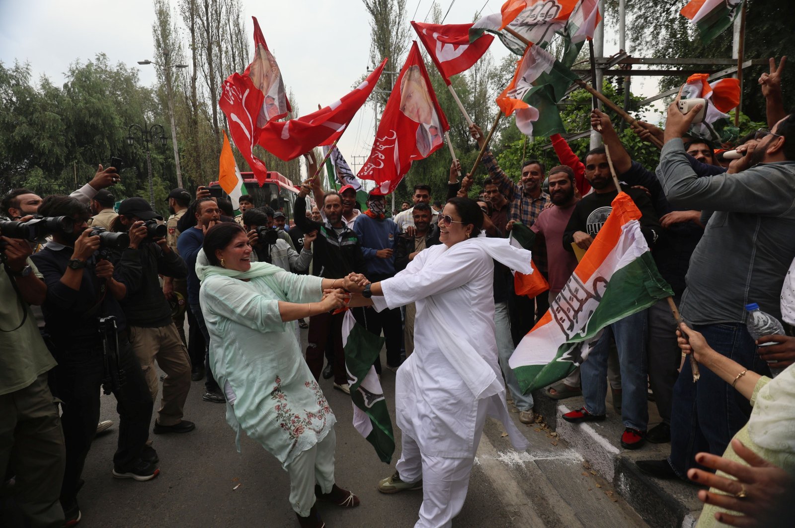 Supporters of Indian National Congress (INC) celebrate outside the counting center in Srinagar, the summer capital of India-controlled Kashmir, Oct. 8, 2024. (EPA Photo)