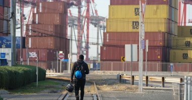 A man walks along the railroad tracks at Port Newark, New Jersey, U.S., Oct. 4, 2024. (AFP Photo)
