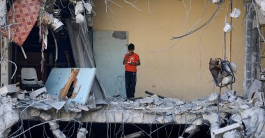 A Palestinian boy stands among rubble in Gaza City, Palestine, July 12, 2024. (Reuters Photo)