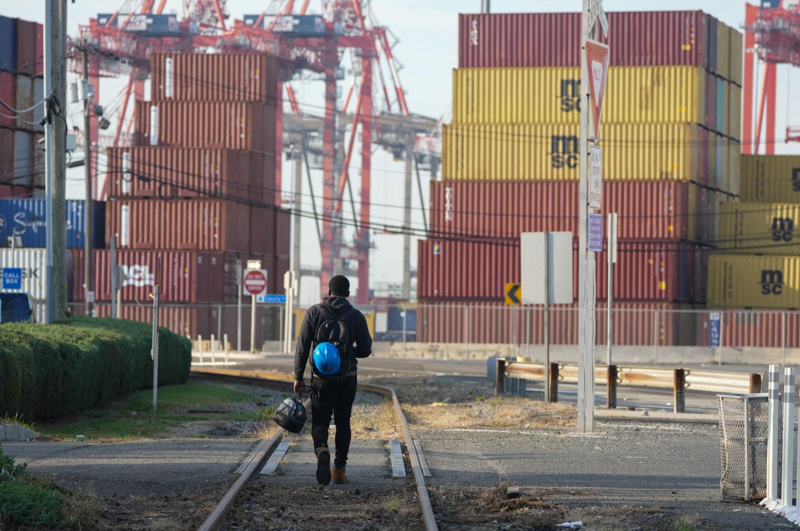 A man walks along the railroad tracks at Port Newark, New Jersey, U.S., Oct. 4, 2024. (AFP Photo)