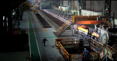 Employees work at a hot rolling plant during a government-organized media tour to Baoshan Iron &amp; Steel Co., Ltd. (Baosteel), a subsidiary of China Baowu Steel Group, Shanghai, China, Sept. 16, 2022. (Reuters Photo)