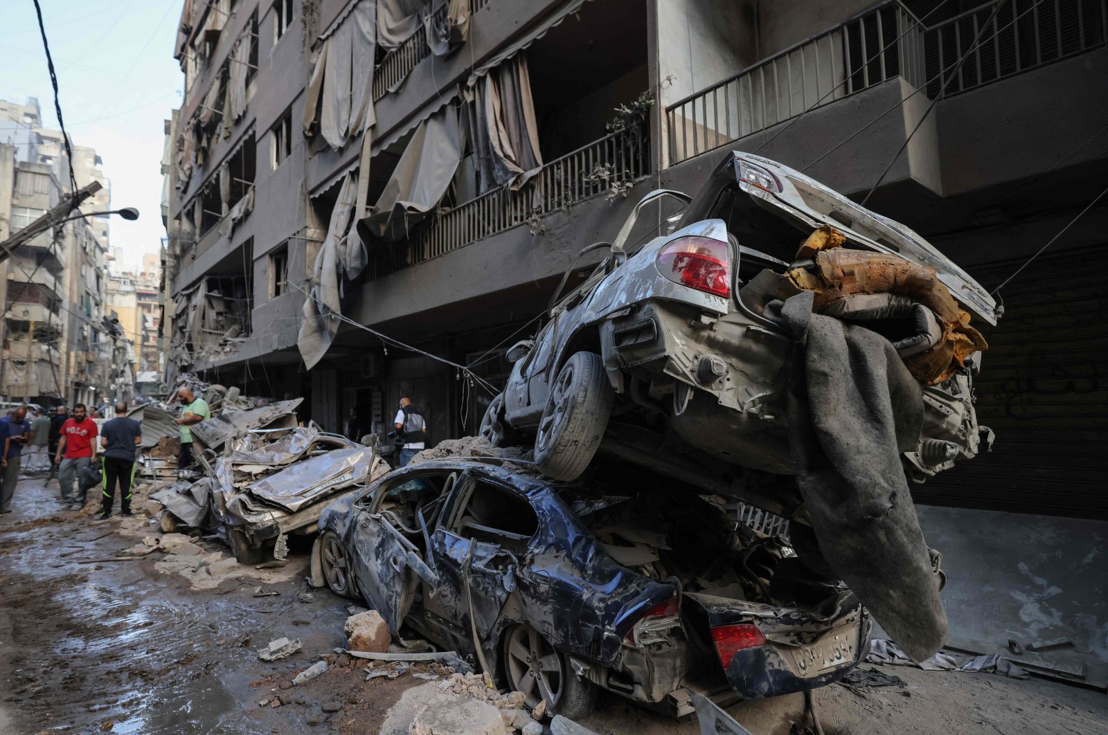 Wrecked cars sit at the site of an Israeli airstrike in the Basta area amid the ongoing conflict between Israel and Hezbollah, Beirut, Lebanon, Oct. 11, 2024. (AFP Photo)