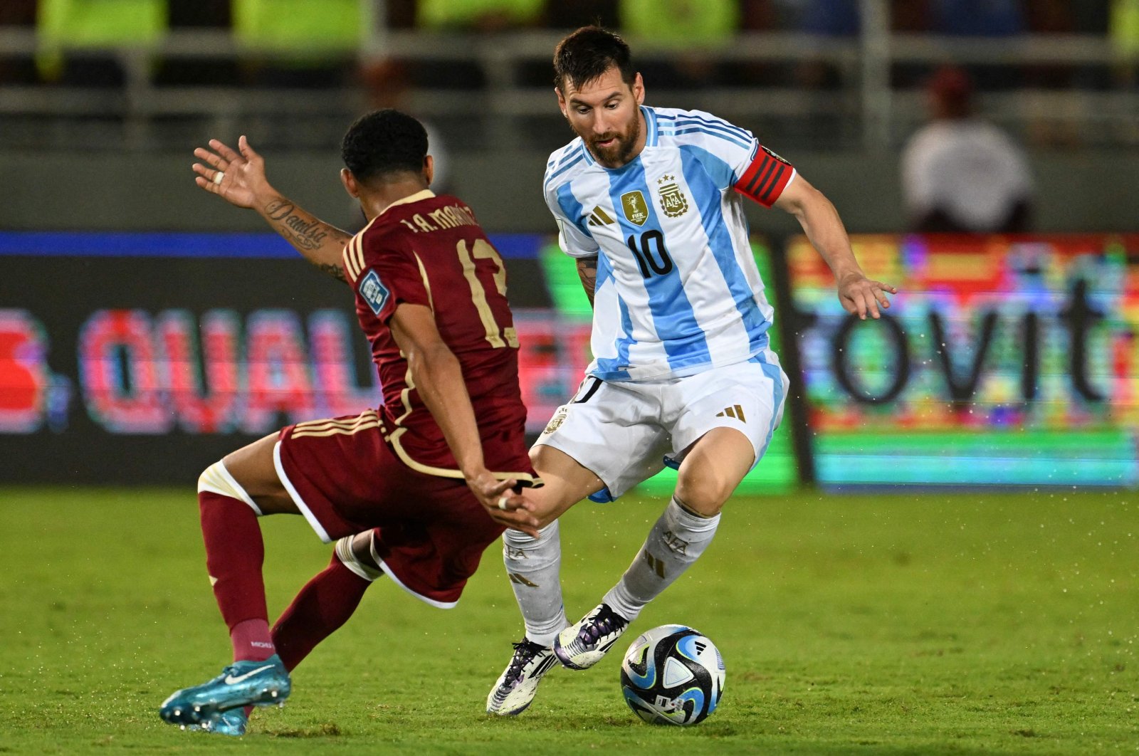 Argentina&#039;s forward Lionel Messi (R) and Venezuela&#039;s midfielder Jose Martinez fight for the ball during the 2026 FIFA World Cup South American qualifiers football match between Venezuela and Argentina, at the Monumental de Maturin stadium, Maturin, Venezuela, Oct. 10, 2024. (AFP Photo)