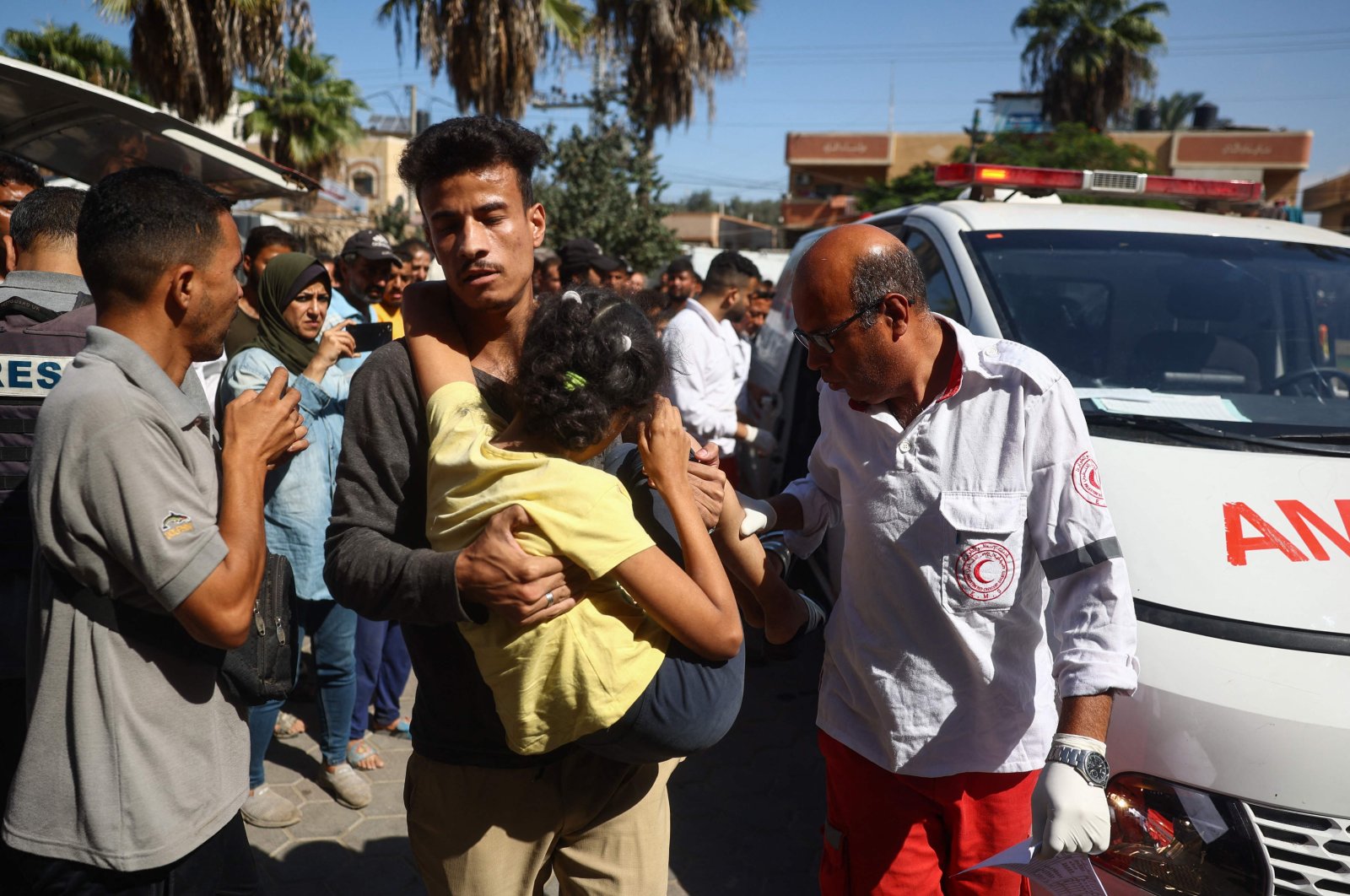 Palestinians transport casualties of Israeli strikes on a displacement camp in the Bureij refugee camp, into the Al-Aqsa Martyrs Hospital in Deir al-Balah, Gaza Strip, Palestine, Oct. 8, 2024. (AFP Photo)