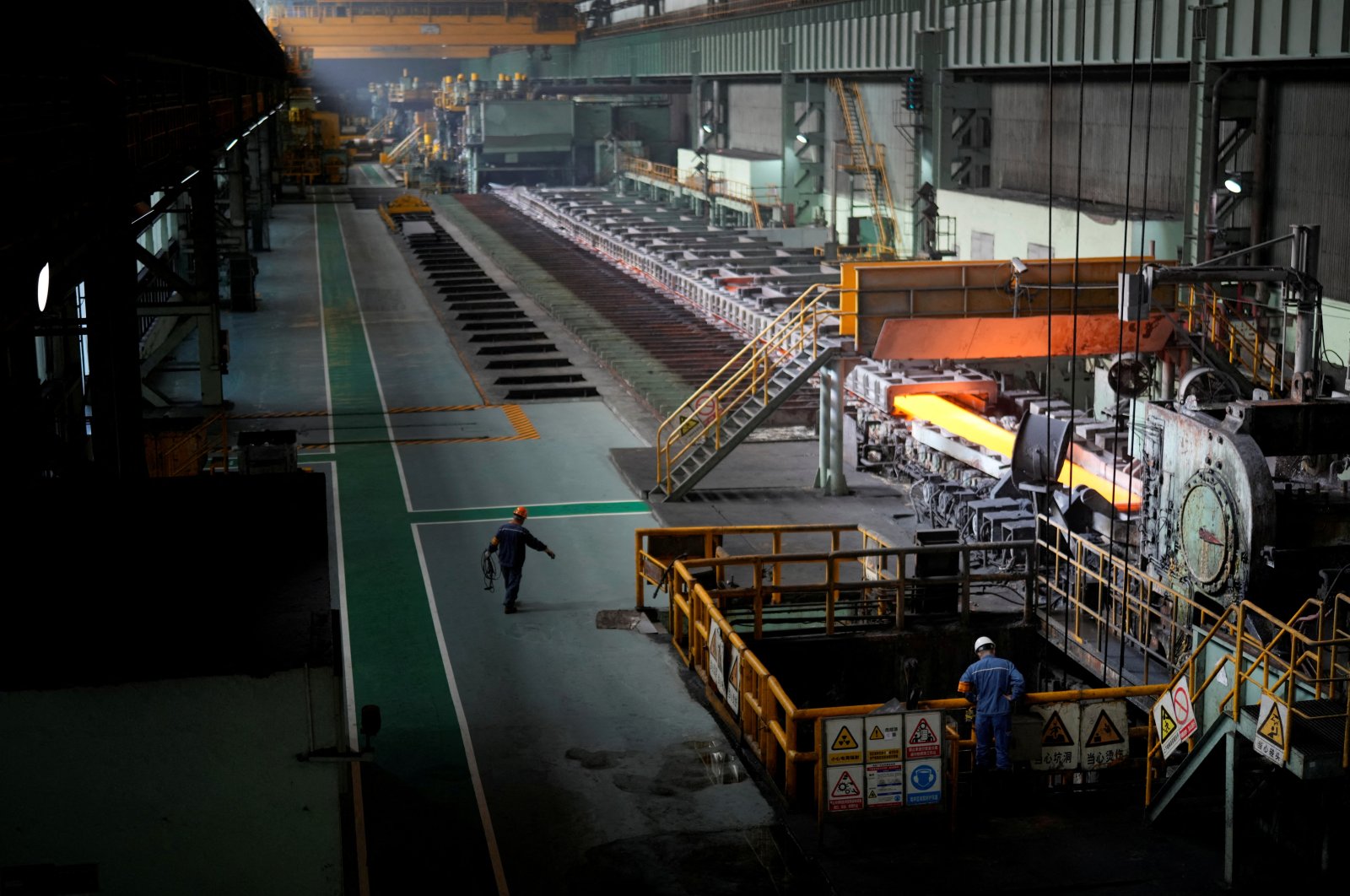 Employees work at a hot rolling plant during a government-organized media tour to Baoshan Iron &amp; Steel Co., Ltd. (Baosteel), a subsidiary of China Baowu Steel Group, Shanghai, China, Sept. 16, 2022. (Reuters Photo)