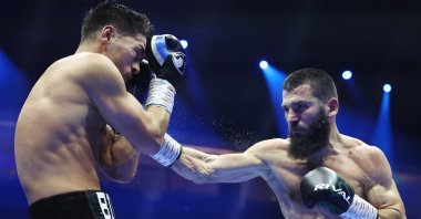 Artur Beterbiev punches Dmitrii Bivol during the IBF, IBO, WBC and WBO World Light-Heavyweight titles&#039; fight, Riyadh, October 13, 2024. (Getty Images)