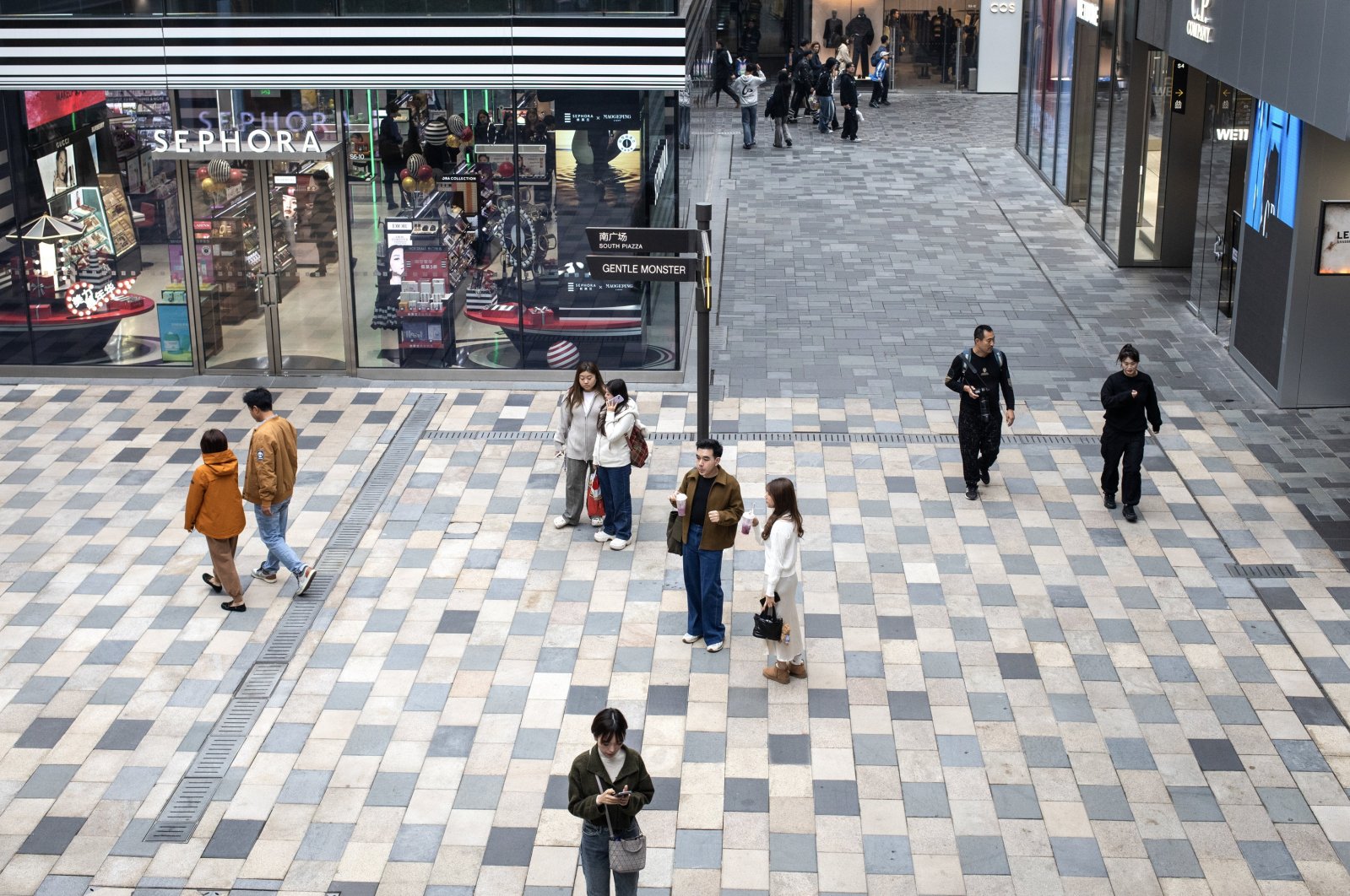 Shoppers pass by a Sephora store at a luxury mall, Beijing, China, Oct. 13, 2024. (EPA Photo)