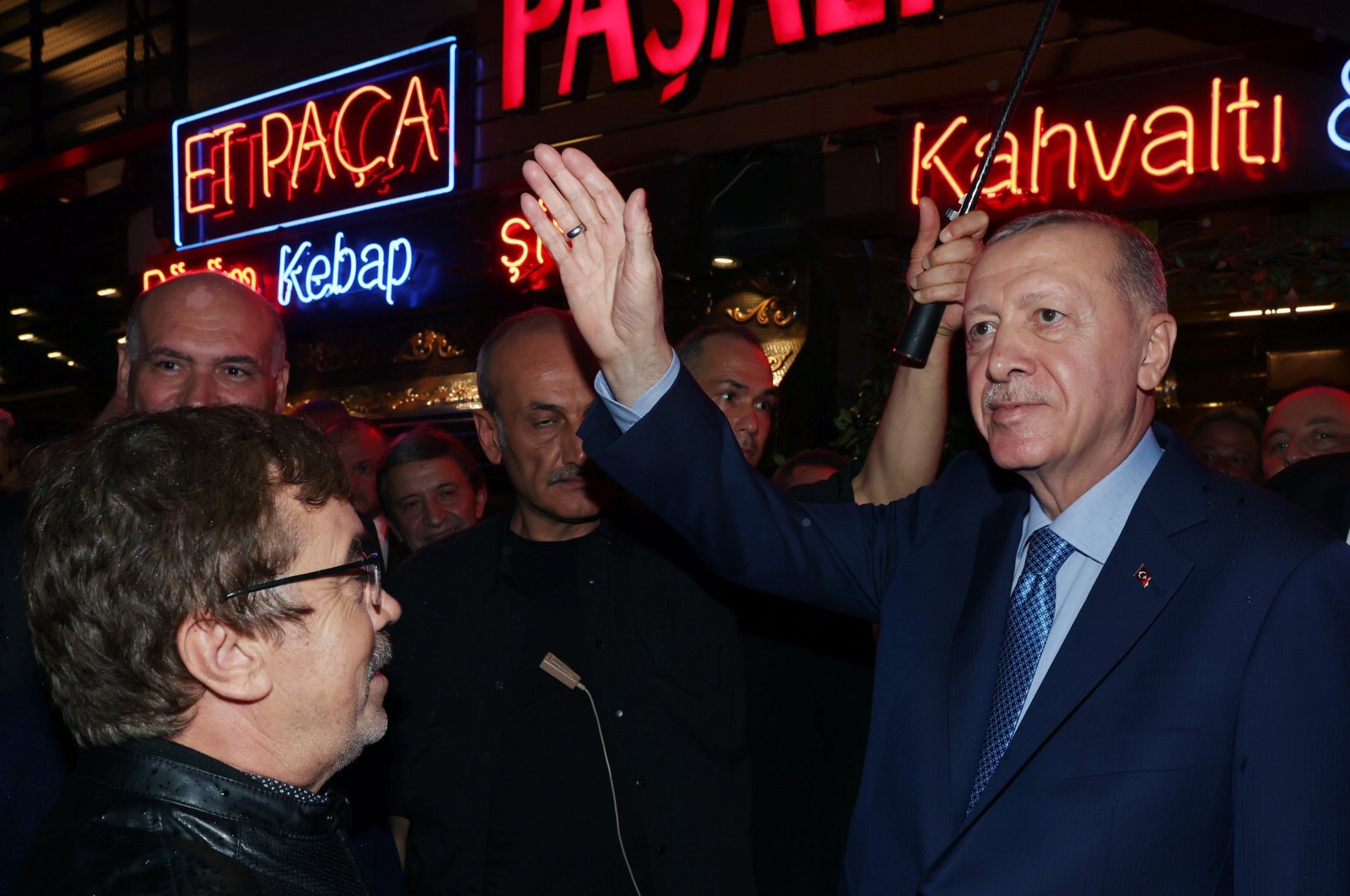 President Recep Tayyip Erdoğan greets people as he leaves a restaurant, Istanbul, Türkiye, Oct. 12, 2024. (AA Photo)