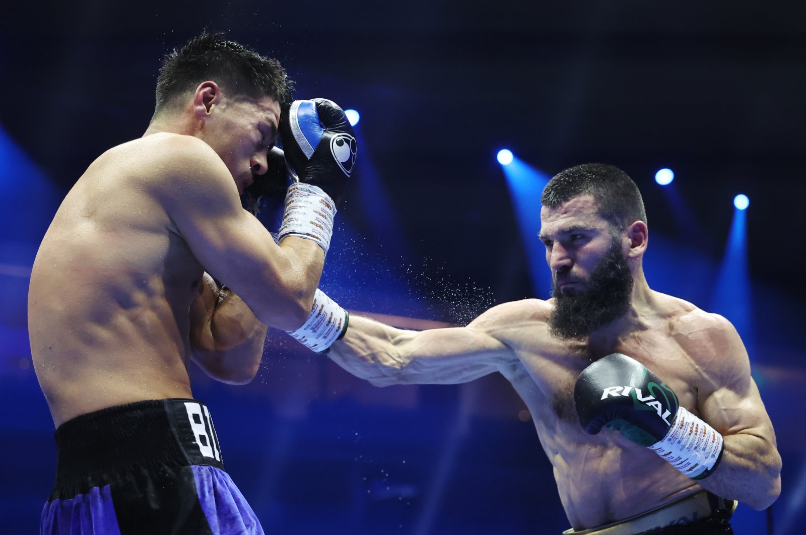 Artur Beterbiev punches Dmitrii Bivol during the IBF, IBO, WBC and WBO World Light-Heavyweight titles&#039; fight, Riyadh, October 13, 2024. (Getty Images)