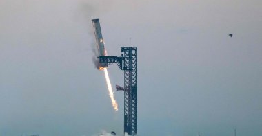 Starship&#039;s Super Heavy Booster is grappled at the launch pad in Starbase near Boca Chica, Texas during the Starship Flight 5 test, U.S., Oct. 13, 2024. (AFP Photo)