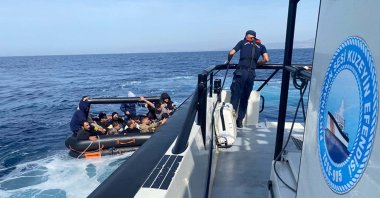 The Turkish coast guard picks up a dinghy carrying irregular migrants off the coast of Izmir, Türkiye, Oct. 13, 2024. (DHA Photo)