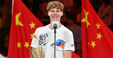 Italy's Jannik Sinner speaks while holding his winner's trophy following victory against Serbia’s Novak Djokovic in their men's singles final match at the Shanghai Masters, Shanghai, China, Oct. 13, 2024. (AFP Photo)