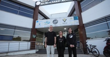 Ayşe Arslan (C), a dedicated science teacher at BILSEM, and Ömer Selim Esen (R), a 14-year-old ninth grader from Düzce Turgut Özal Anadolu High School, pose together in Düzce, Türkiye, Oct. 11, 2024. (AA Photo)