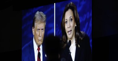 A tv screen shows the presidential debate between Donald Trump and Kamala Harris, in Philadelphia, U.S., Sept. 10, 2024. (AP Photo)