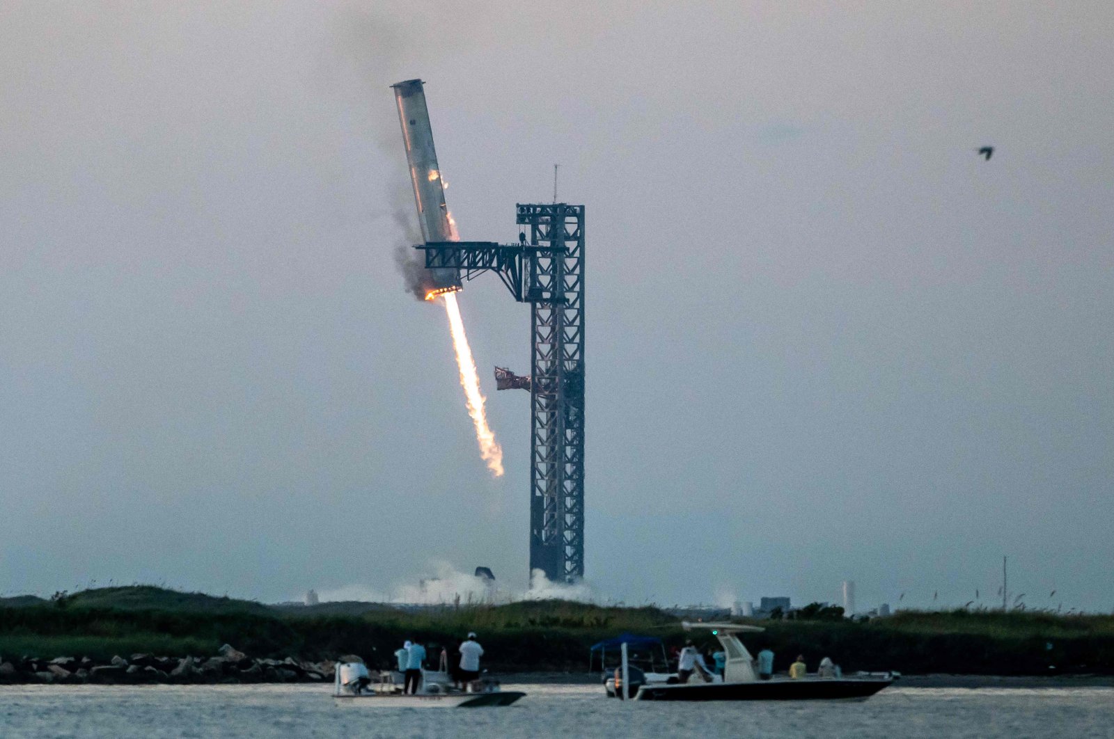 Starship&#039;s Super Heavy Booster is grappled at the launch pad in Starbase near Boca Chica, Texas during the Starship Flight 5 test, U.S., Oct. 13, 2024. (AFP Photo)