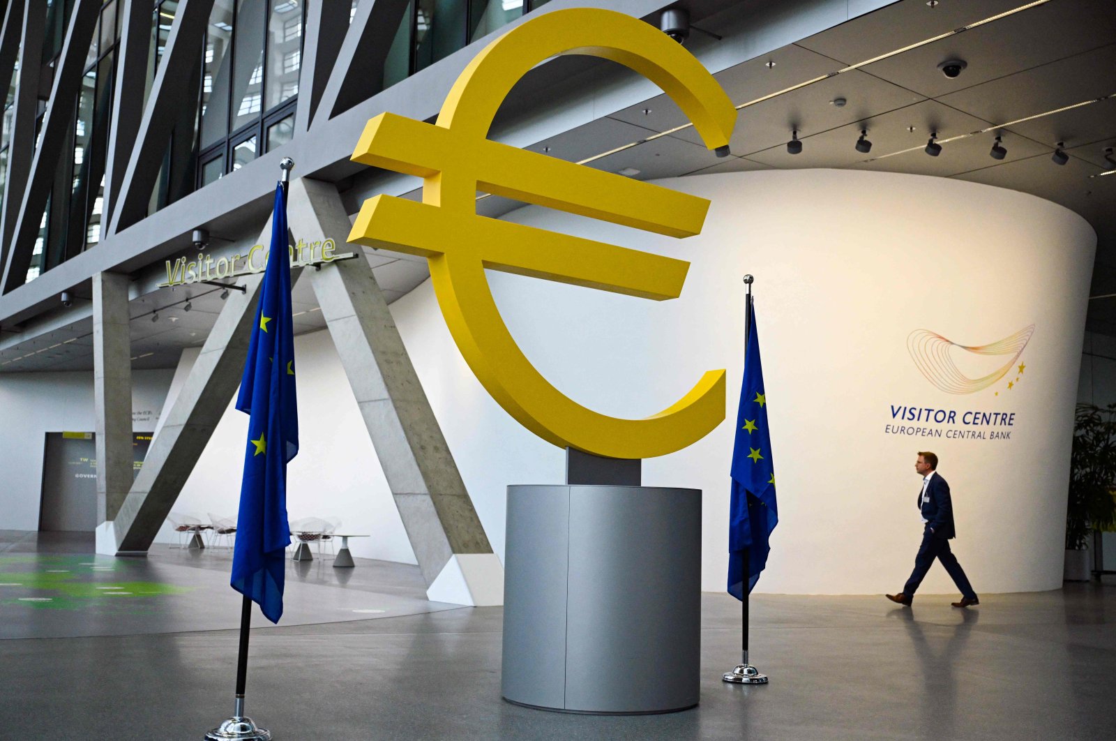 A man walks past a giant Euro logo at the visitor center of the European Central Bank (ECB) headquarters, Frankfurt, Germany, July 18, 2024. (AFP Photo)