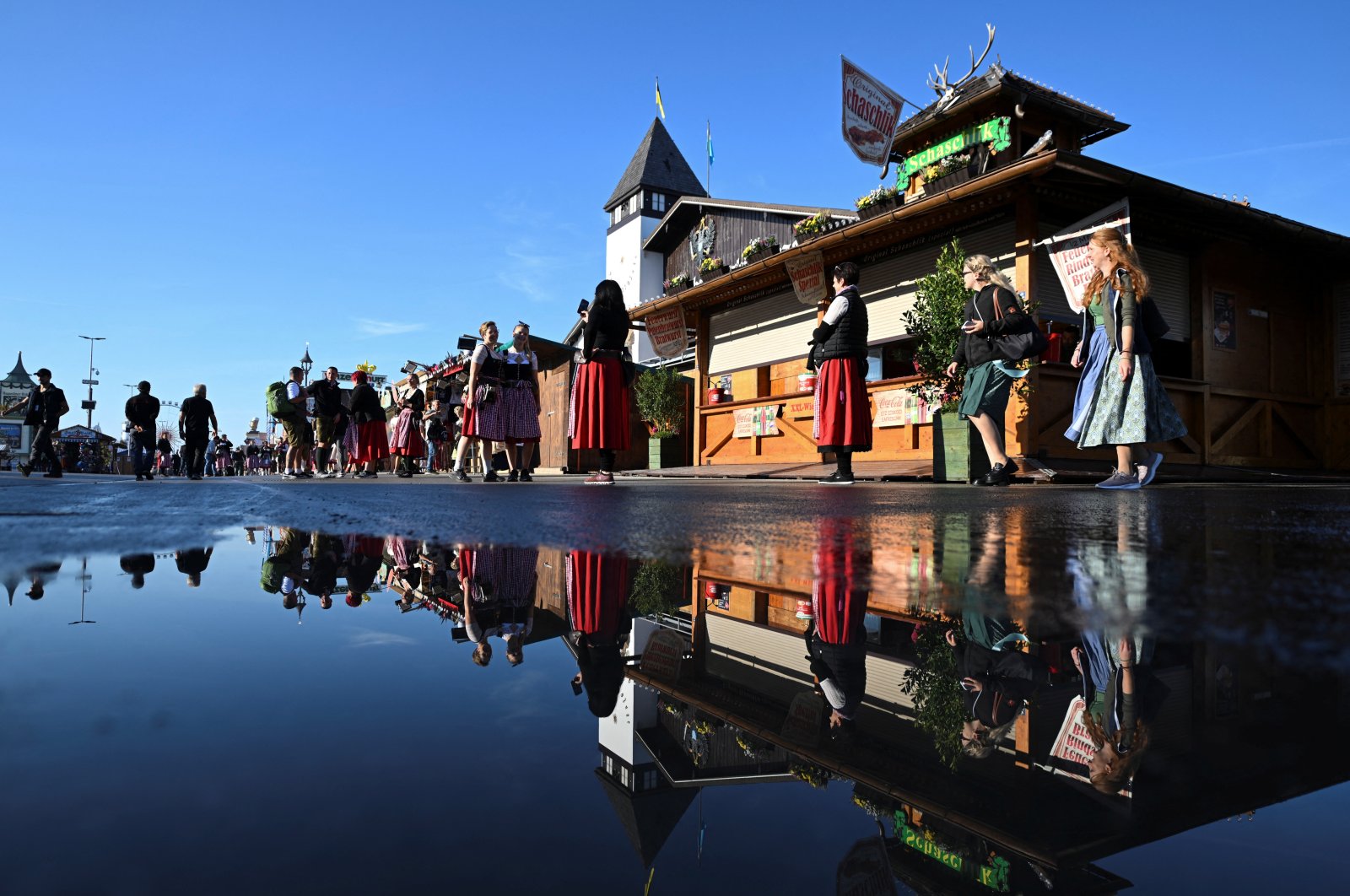 People walk on the day of the official opening of the 189th Oktoberfest, the world&#039;s largest beer festival, Munich, Germany, Sept. 21, 2024. (Reuters Photo)