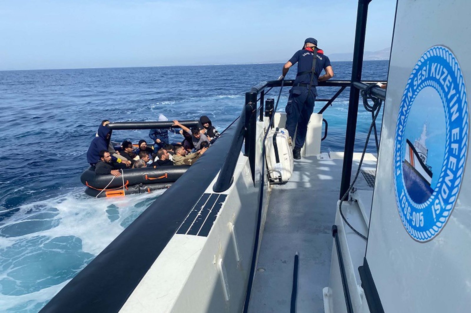 The Turkish coast guard picks up a dinghy carrying irregular migrants off the coast of Izmir, Türkiye, Oct. 13, 2024. (DHA Photo)