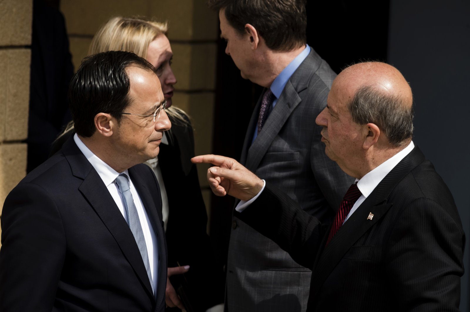 Greek Cypriot President Nikos Christodoulides (L) and Turkish Cypriot President Ersin Tatar (R) talk as the U.N. Secretary-General&#039;s Special Representative in Cyprus Colin Stewart stands behind them after their meeting at the U.N. compound inside the U.N buffer zone in the divided capital Nicosia, Feb. 23, 2023. (AP Photo)